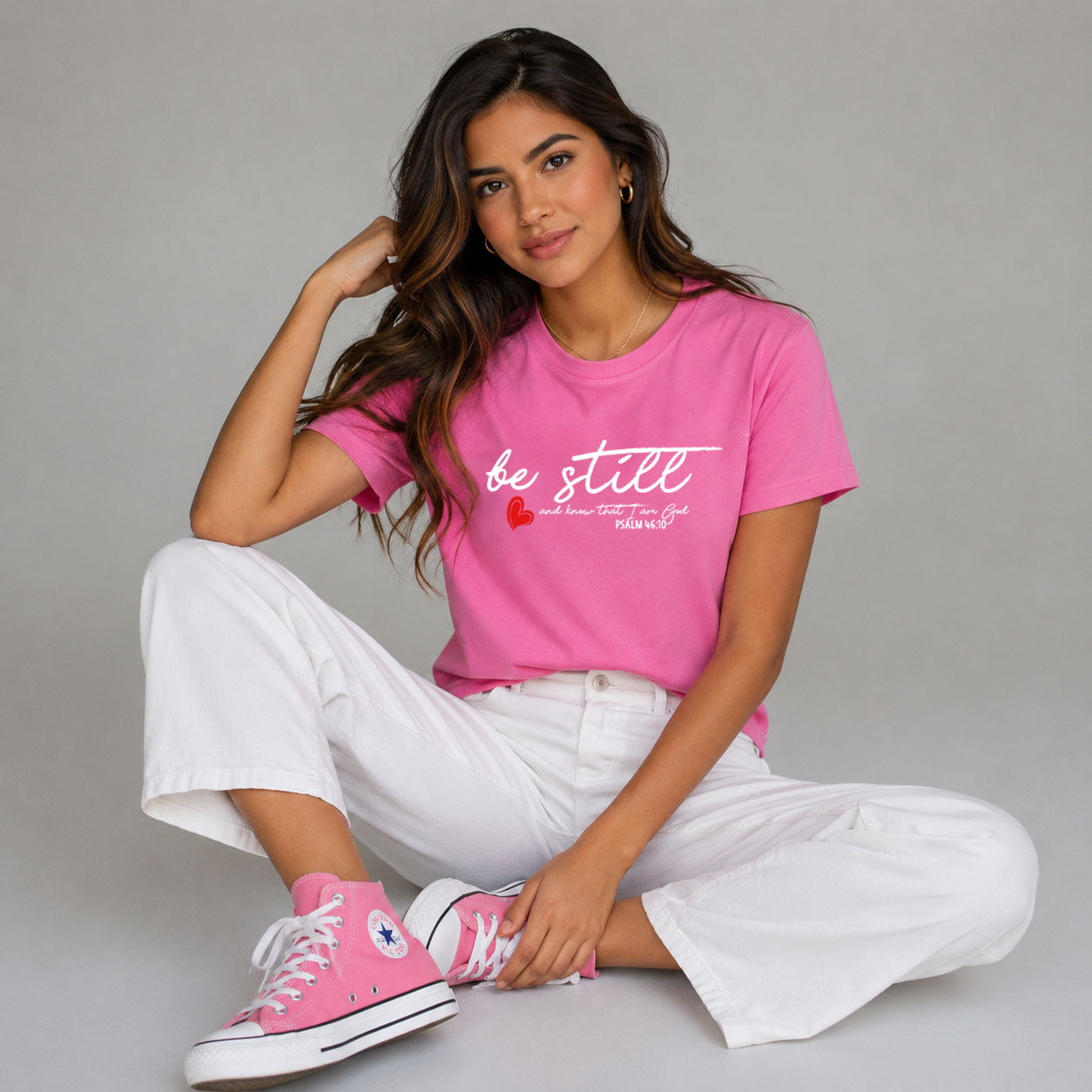 Women's softstyle T-shirt by Printify featuring a "Be Still" design, shown in a relaxed fit with a smooth fabric texture.