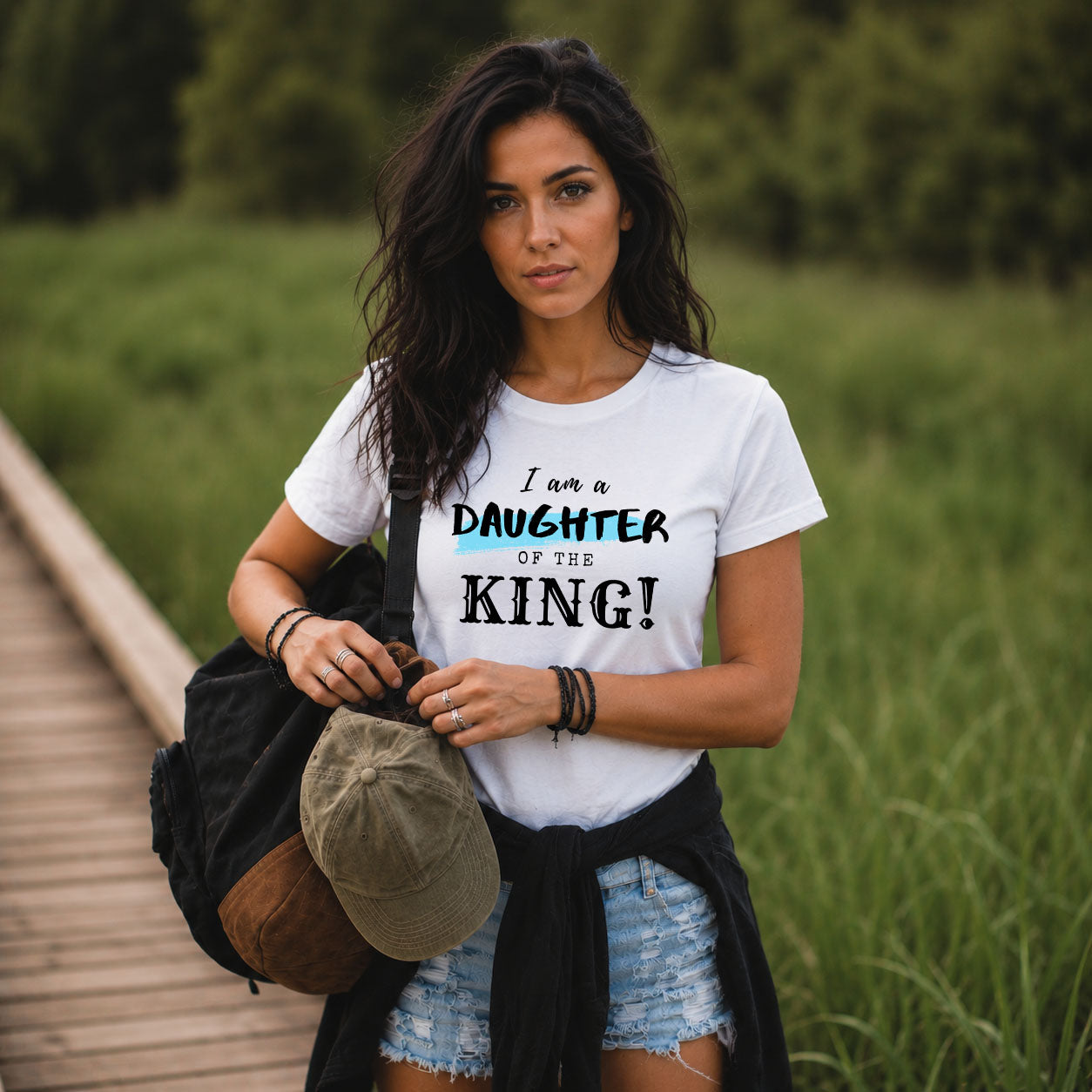 Women's Softstyle T-shirt by Printify with the message "I am a Daughter of the King" printed on the front.