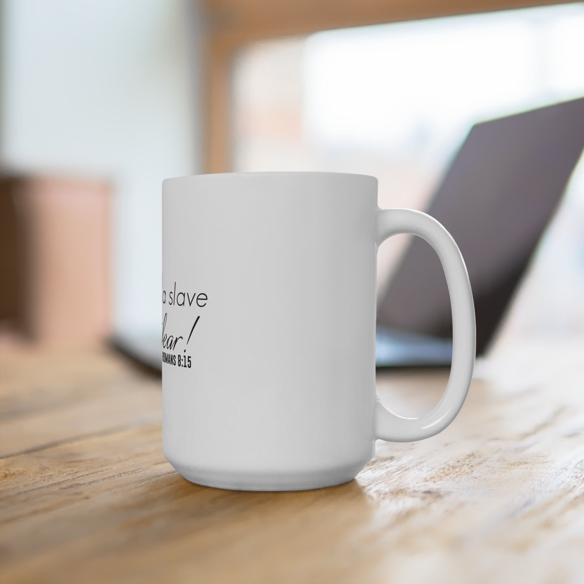 White 15oz mug with "I am No Longer A Slave to Fear" printed in black text, ceramic coffee mug with handle.