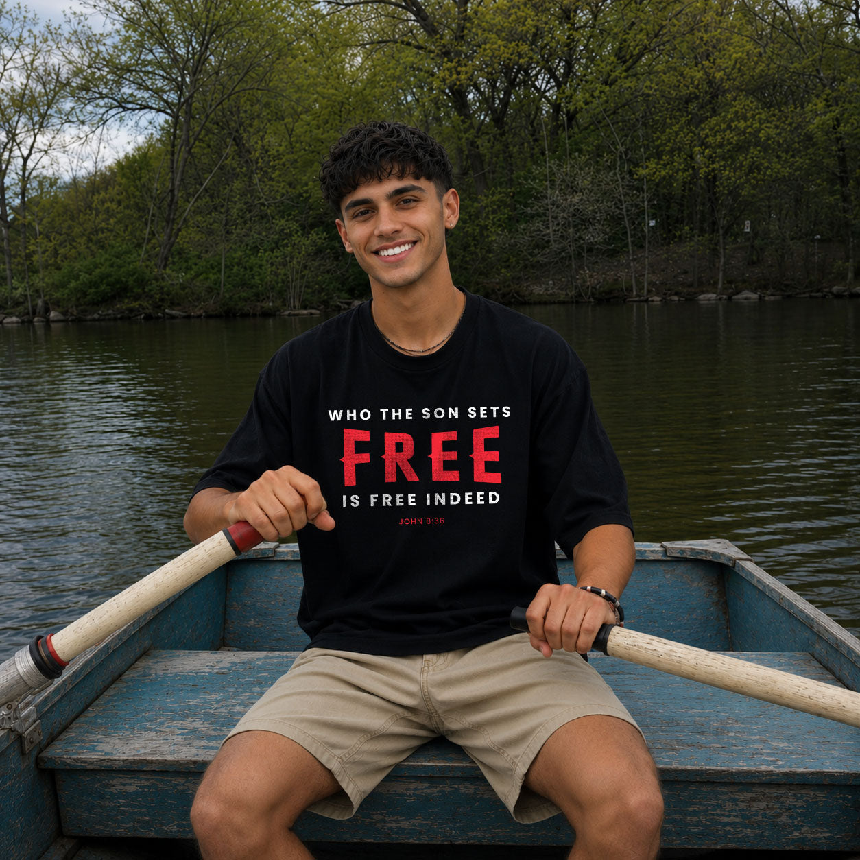 Unisex softstyle T-shirt with "Who the Son Sets Free is Free Indeed" print, in white with black text, by Printify.