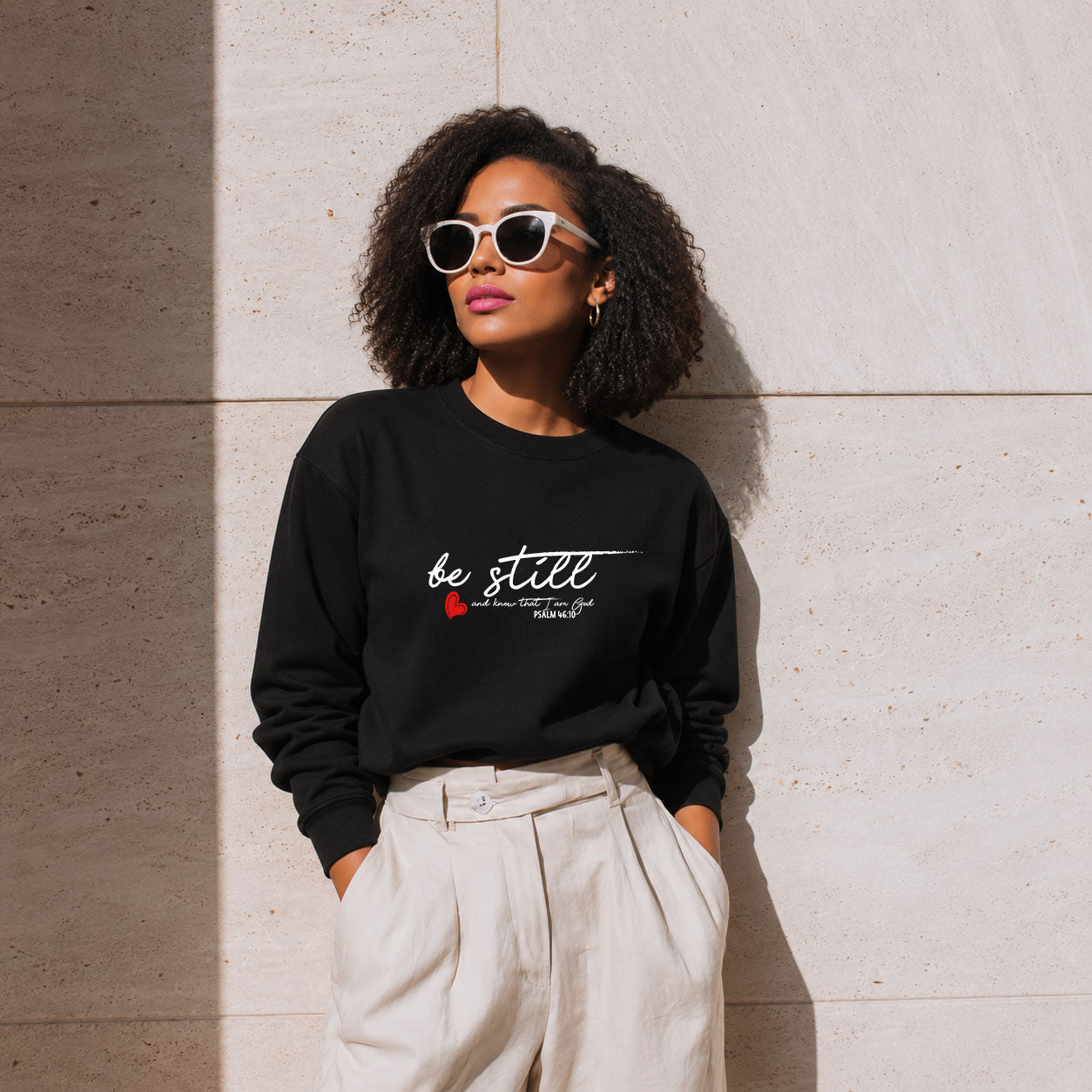 Unisex Printify Be Still midweight softstyle fleece crewneck sweatshirt in gray, showing the front view with printed design.