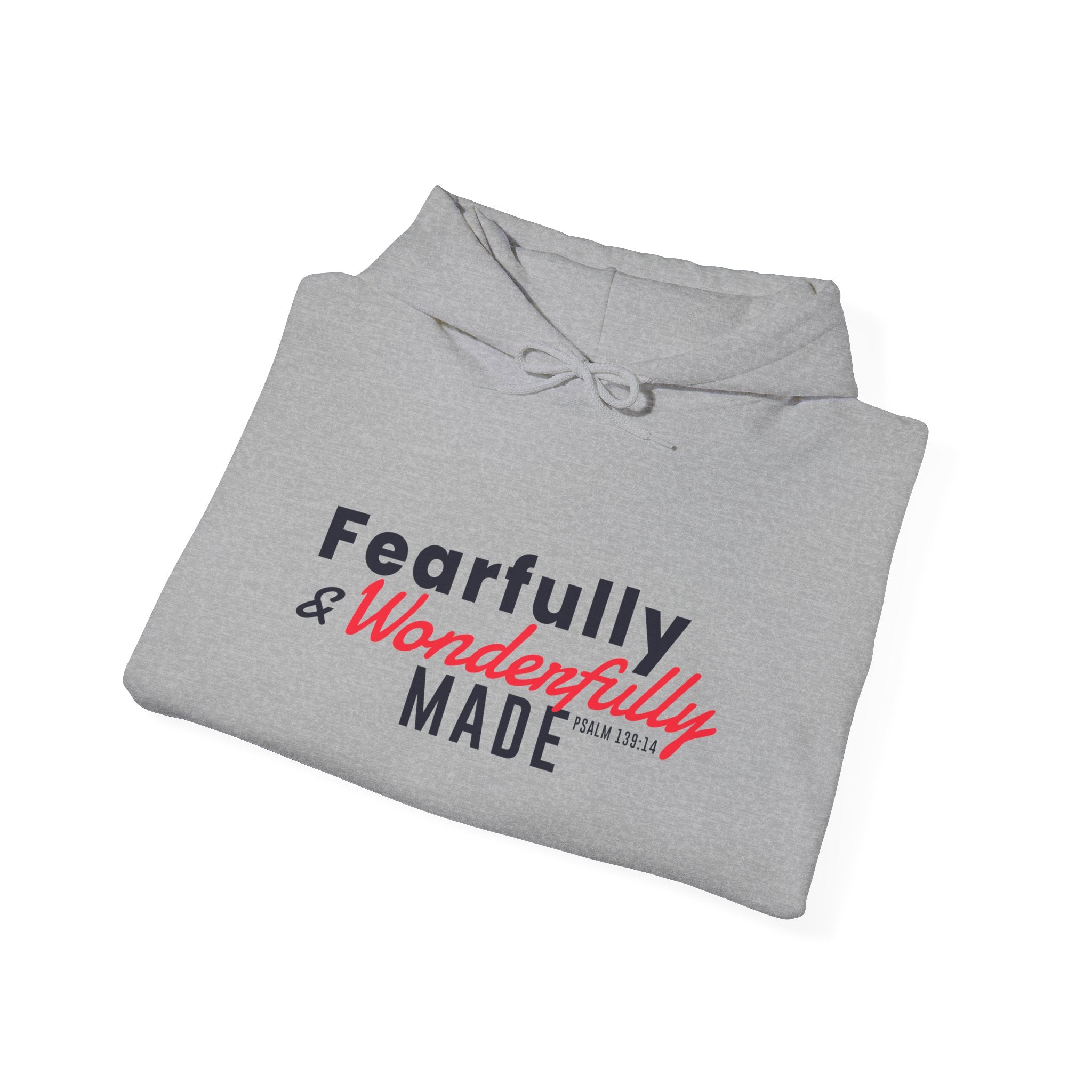 Unisex Heavy Blend hoodie with "Fearfully and Wonderfully Made" print, featuring a front pocket and hood, in a comfortable, casual style.