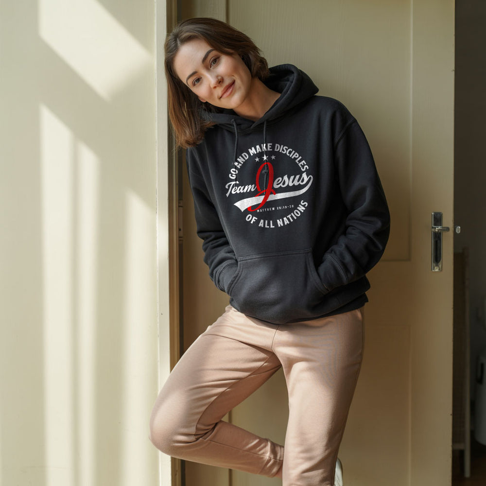 Unisex Heavy Blend™ Hoodie with "Team Jesus" print, featuring a hood and front pocket in a casual, comfortable design.