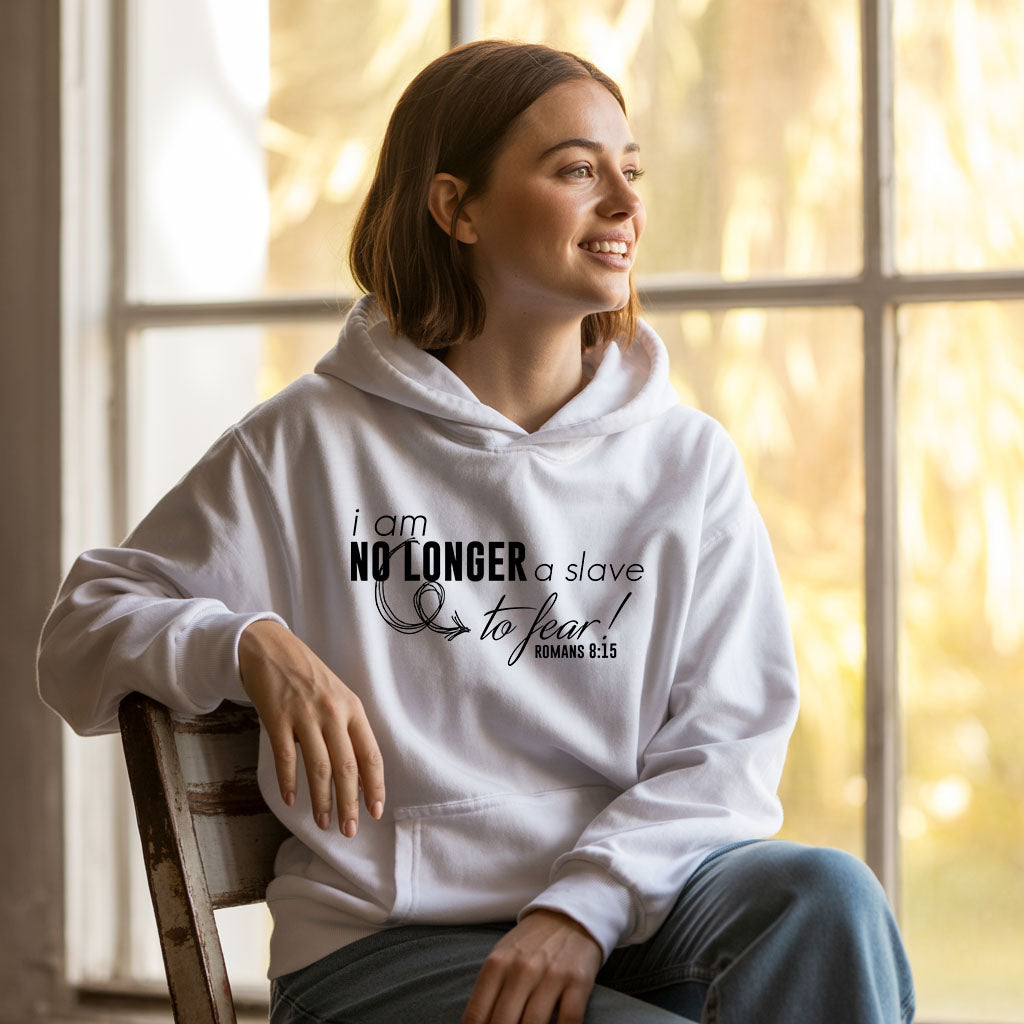 Unisex Heavy Blend hoodie with "I am No Longer A Slave to Fear" slogan, displayed on a hanger, in black color.