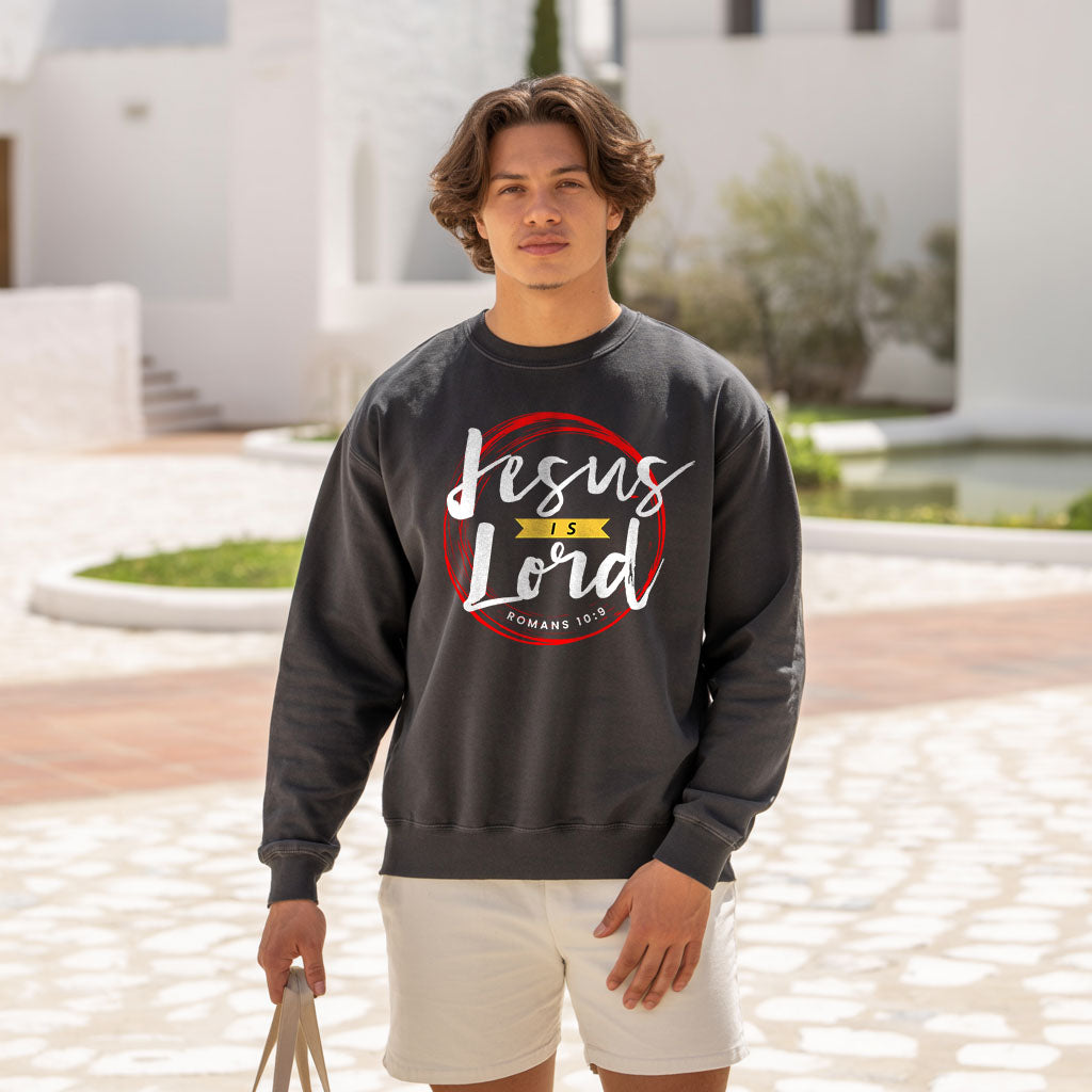 Unisex midweight softstyle fleece crewneck sweatshirt with "Jesus is Lord" slogan, made by Printify, shown in black fabric.