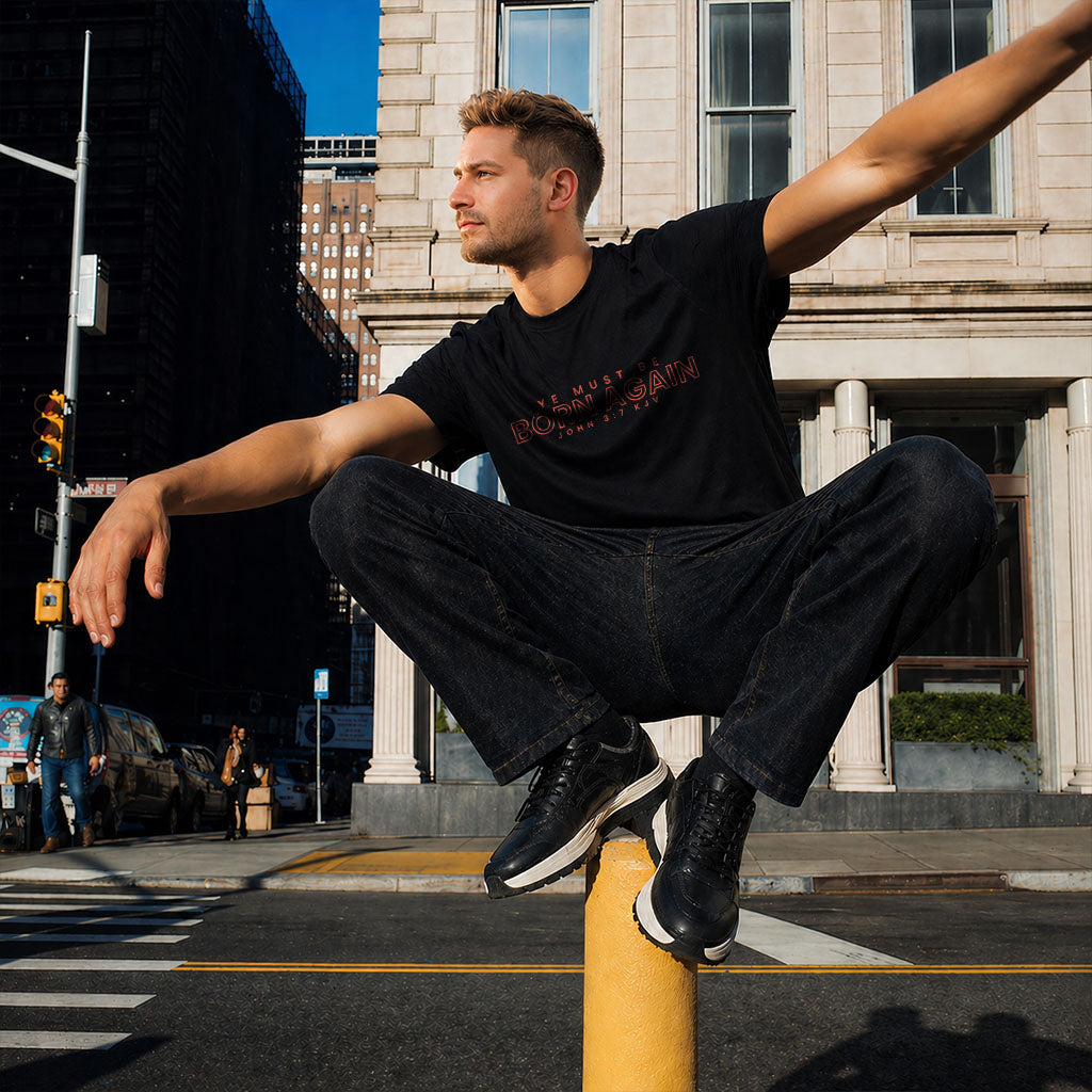 Unisex Softstyle T-Shirt by Printify featuring the "Ye Must Be Born Again" design, shown in a casual fit with vibrant print.