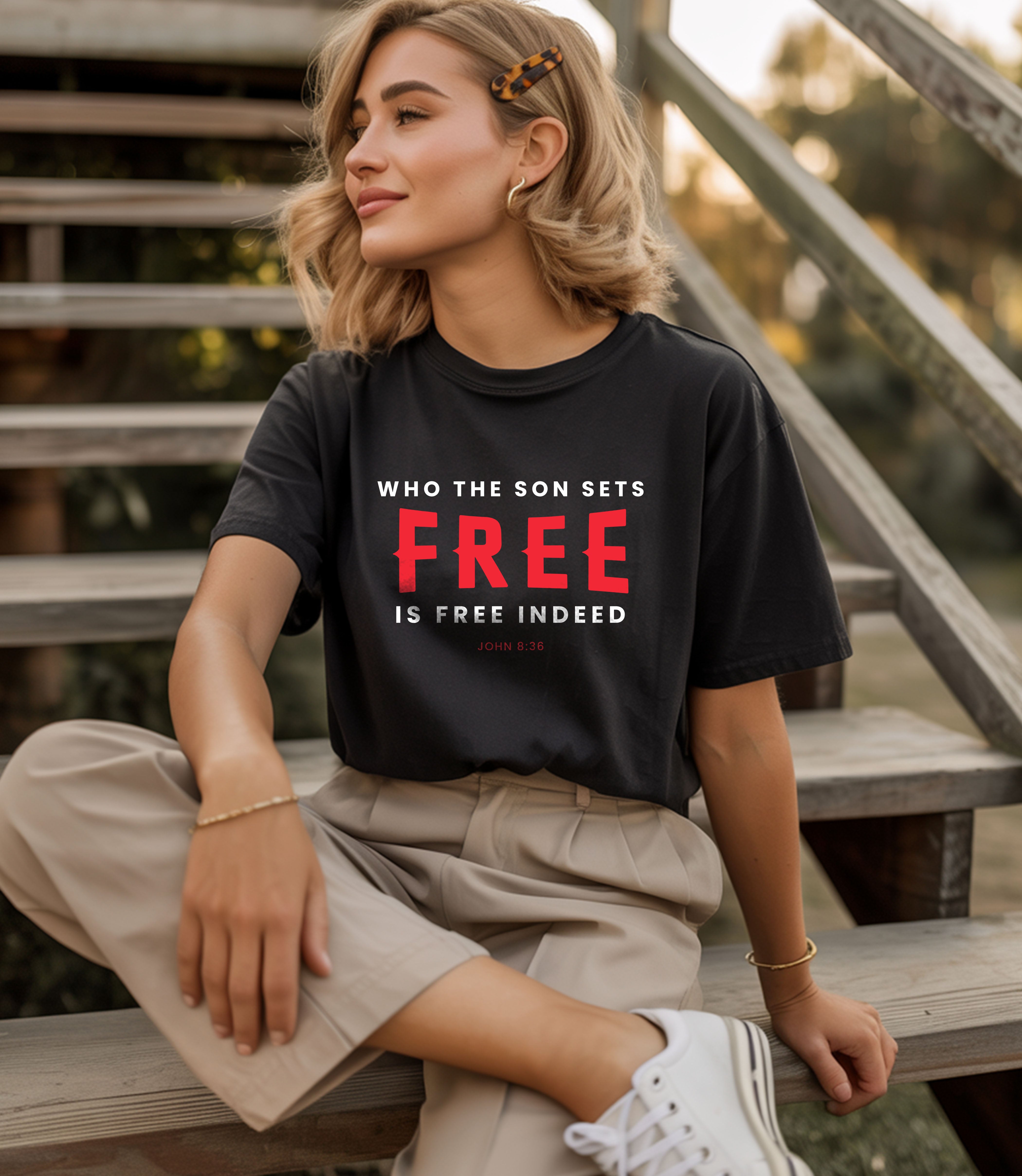 Unisex softstyle T-shirt featuring the "Who the Son Sets Free is Free Indeed" design by Printify, shown in a casual wear setting.