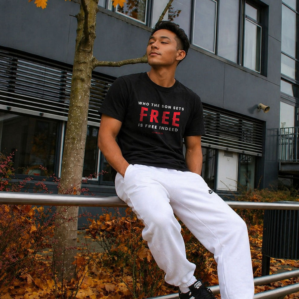 Unisex softstyle T-shirt with "Who the Son Sets Free is Free Indeed" printed on front, in black lettering, by Printify.