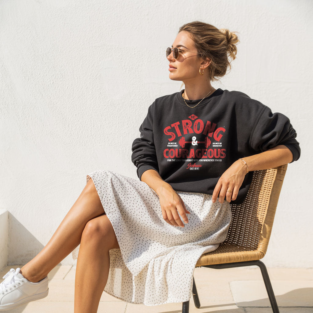 Unisex midweight softstyle fleece crewneck sweatshirt with "Be Strong and Courageous" printed message, by Printify.
