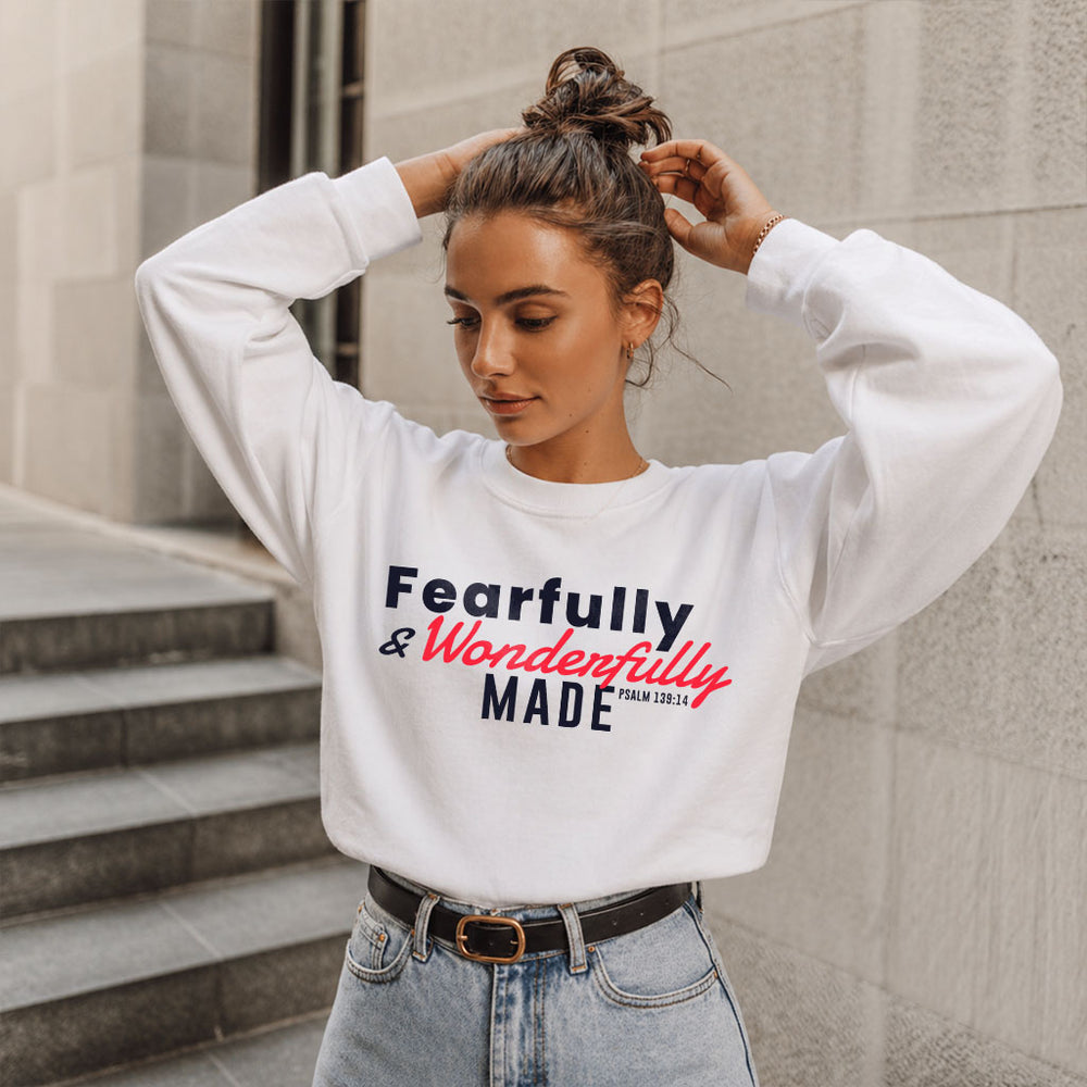 Unisex midweight softstyle fleece crewneck sweatshirt with "Fearfully and Wonderfully Made" print, by Printify.